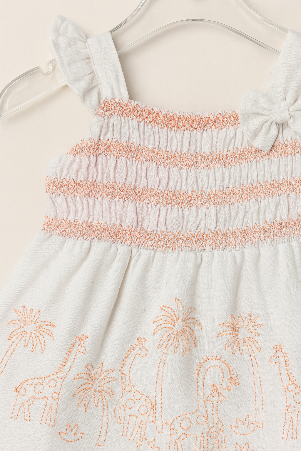 Smocked cotton frock with safari embroidery