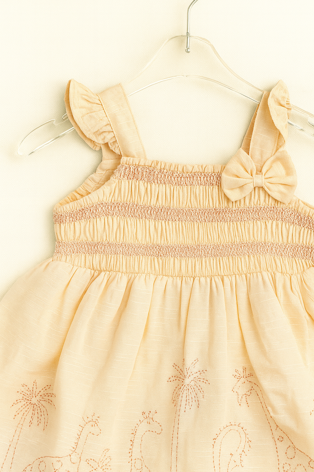 Smocked cotton frock with safari embroidery