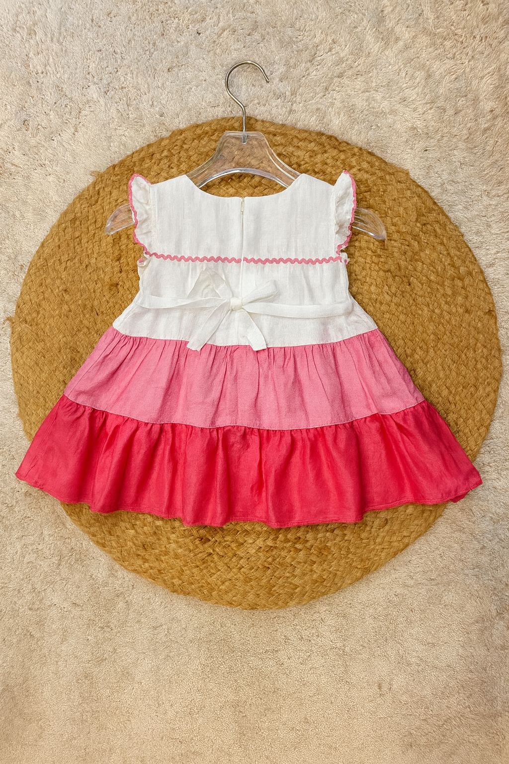 Three-tone pink frock with floral patch