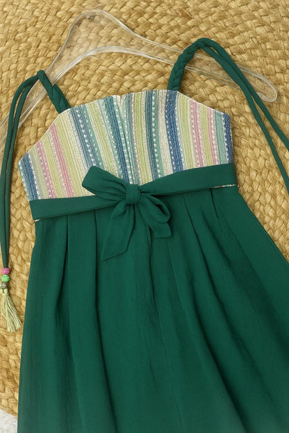 Green frock with multicolor striped yoke