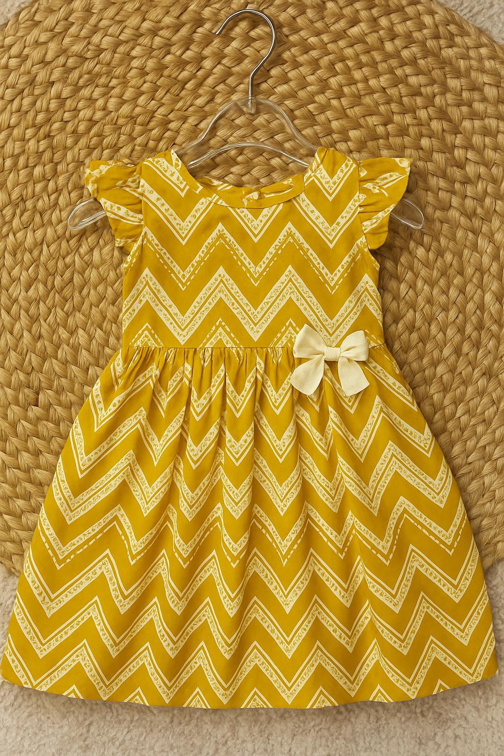 Yellow zigzag frock with cute bow detail
