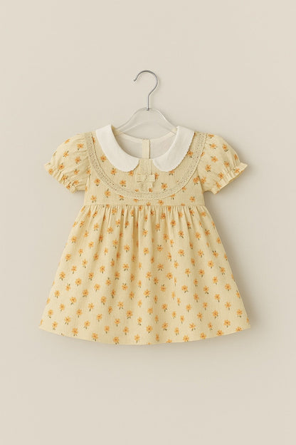 Muslin Charming Yellow Floral Frock with White Peter Pan Collar