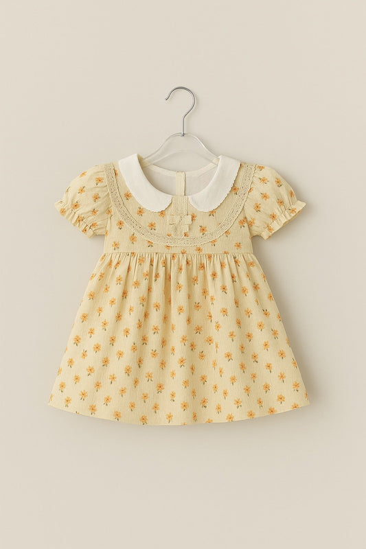 Muslin Charming Yellow Floral Frock with White Peter Pan Collar