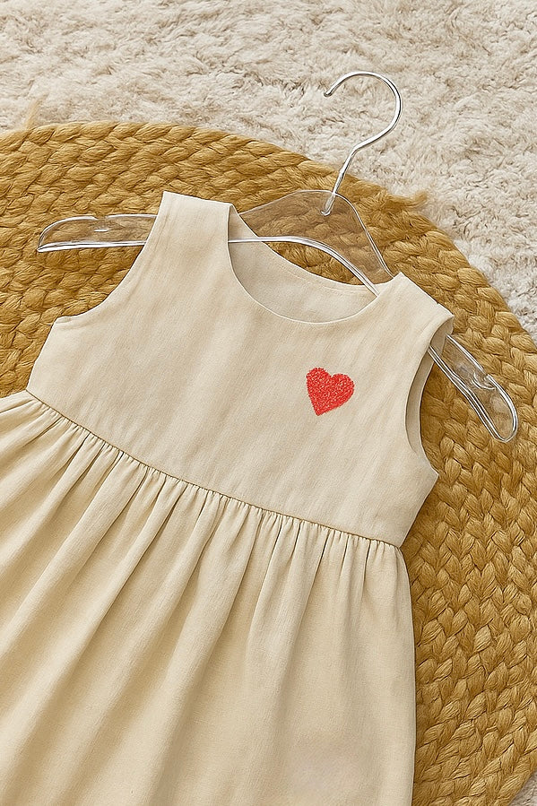 Pink cotton frock with colorful flower appliqués